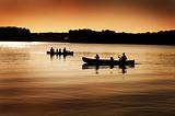 Silhouette of Canoers on Lake