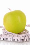 Apple and a measure tape, diet concept