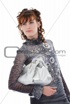 studio shot of posing woman with bag
