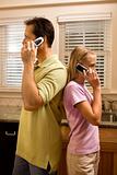 Man and Young Girl on Phones