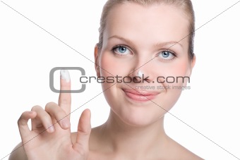 women applying cream to her nose