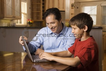 Man and Young Boy on Laptop