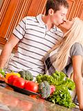 Young Couple Kissing in Kitchen