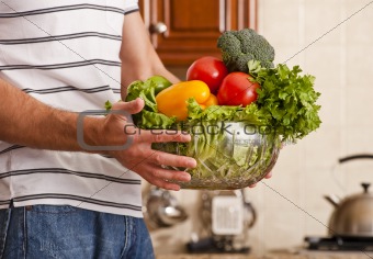 Man Holding Bowl of Vegetables