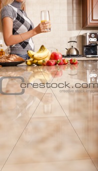 Young Woman Holding Glass of Orange Juice