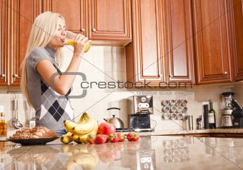 Young Woman Drinking Glass of Orange Juice
