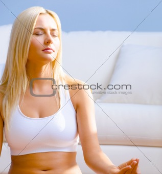 Young Woman Sitting in Meditation