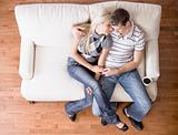 Young Couple Sitting on Love Seat