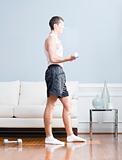 Man Using Arm Weights in Living Room