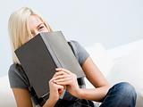 Laughing Woman Holding a Book