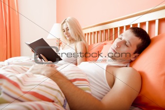 Couple Relaxing in Bed