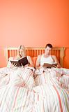 Couple Reading in Bed