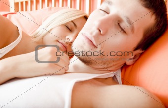 Couple Sleeping in Bed