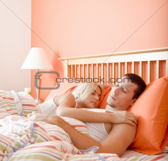 Couple Sleeping in Bed