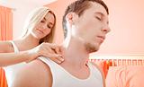 Woman Massaging Man's Shoulders