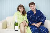 Young happy couple in dressing gowns