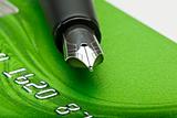 shopping - extreme closeup of a fountain pen and credit card