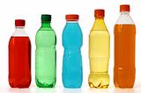 five colored bottles with juice and soda