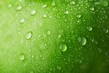 Water drop on green apple surface