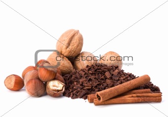 grated chocolate and nuts isolated on white background