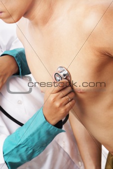 Doctor checking patient heart beat