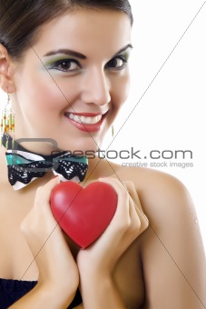 beautiful woman holding a love symbol in hands