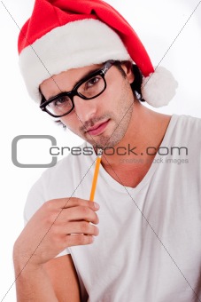 handsome man thinking by wearing santa's hat 