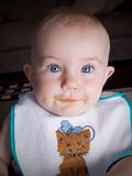 Baby with food on lips