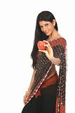 Woman in sari with red apple