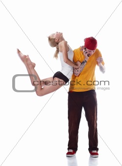 Young ballerina jumping and serious young hip hop dancer isolated on white background