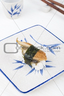 sushi with chopstick and plate