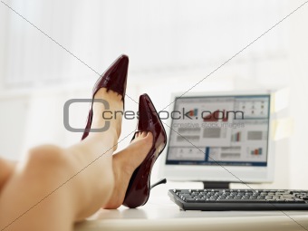 business woman taking off shoes