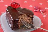 Heart shaped chocolate cake with a bite