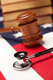 Gavel, Stethoscope and Books on the American Flag with Selective Focus.