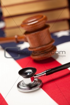 Gavel, Stethoscope and Books on the American Flag with Selective Focus.