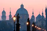 prague - charles bridge and spires of the old town at dawn
