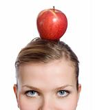 blonde woman with a red apple on her head