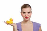 woman with a yellow rubber duck on her hand