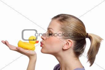 young woman kissing the yellow rubber duck