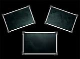 Three Photo frames isolated on black with texture