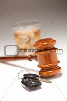 Gavel, Alcoholic Drink & Car Keys on a Gradated Background - Drinking and Driving Concept.