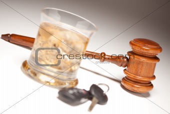 Gavel, Alcoholic Drink & Car Keys on a Gradated Background - Drinking and Driving Concept.