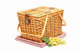 Picnic Basket, Grapes and Folded Blanket Isolated on a White Background.