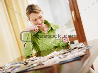 blond woman looking at photos