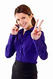  woman with victory gesture and mobile phone