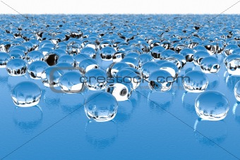 Tousands of glass drops on a wavy surface