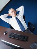 mature businessman relaxing in office