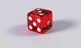 Red game die with refraction