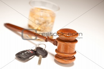 Gavel, Alcoholic Drink & Car Keys on a Gradating to White Background - Drinking and Driving Concept.