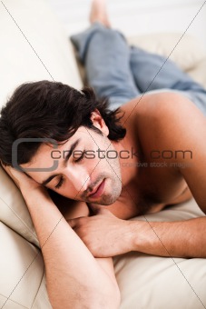 young man relaxing in the sofa